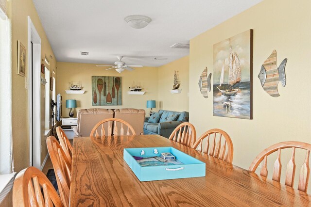 115 Southwind Dr, Surfside Beach, TX 77541 - dining room featuring a ceiling fan