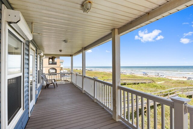 115 Southwind Dr, Surfside Beach, TX 77541 - wooden deck with view of water and beach