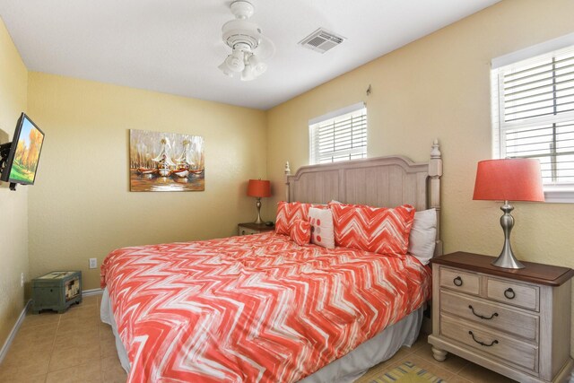 115 Southwind Dr, Surfside Beach, TX 77541 - bedroom featuring multiple windows and light tile patterned floors