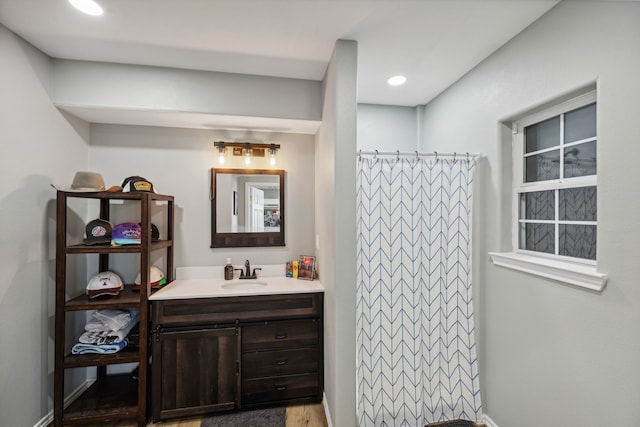 527 Caney Creek Dr, Livingston, TX 77351 - full bathroom with vanity, a shower with curtain, wood finished floors, and recessed lighting