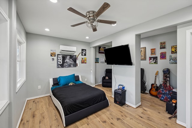 527 Caney Creek Dr, Livingston, TX 77351 - bedroom featuring a wall mounted air conditioner, wood finished floors, a ceiling fan, and recessed lighting
