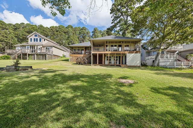 527 Caney Creek Dr, Livingston, TX 77351 - rear view of property with stairs, a deck, and a yard