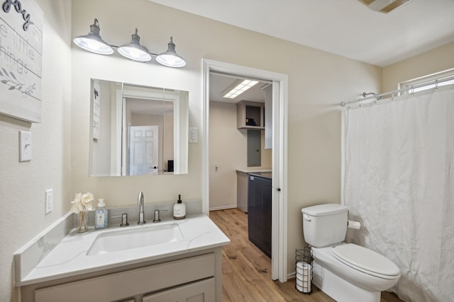 527 Caney Creek Dr, Livingston, TX 77351 - full bath with wood finished floors, vanity, and curtained shower