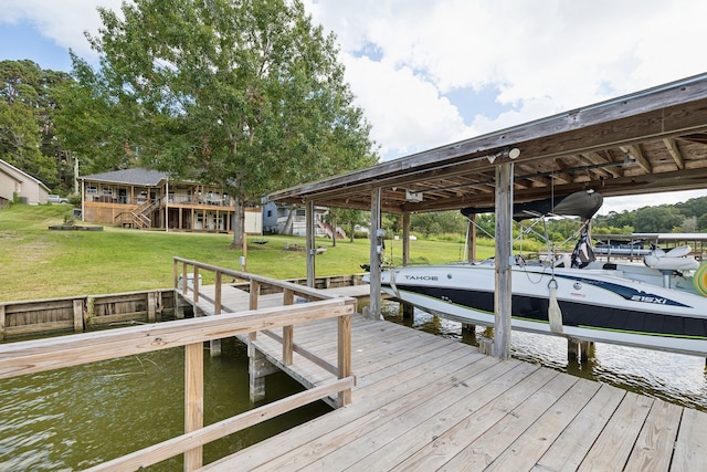 527 Caney Creek Dr, Livingston, TX 77351 - dock with boat lift, a water view, and a lawn