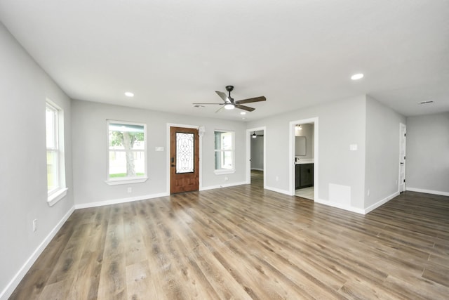 1218 Des Jardines St, Houston, TX 77023 - unfurnished living room featuring recessed lighting, wood finished floors, and a ceiling fan