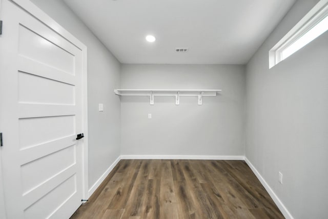 1218 Des Jardines St, Houston, TX 77023 - washroom with dark wood finished floors and recessed lighting