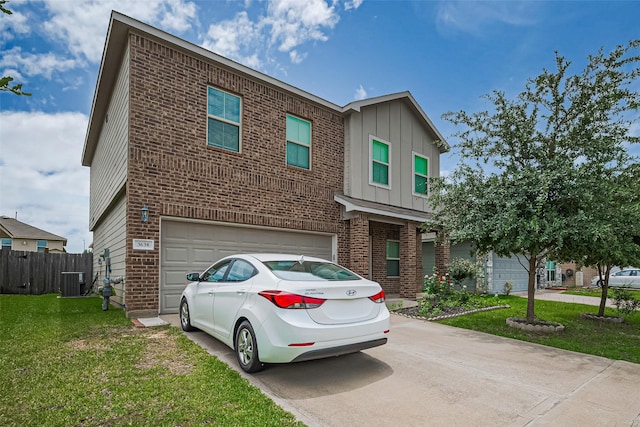 3638 Bright Moon Ct, Katy, TX 77449 - view of front facade with brick siding, concrete driveway, an attached garage, and board and batten siding