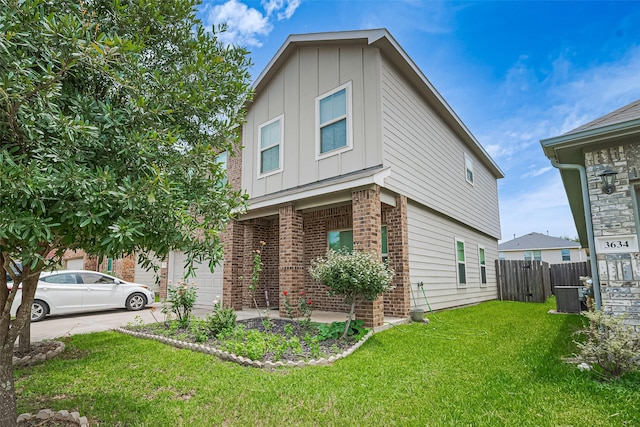 3638 Bright Moon Ct, Katy, TX 77449 - view of front of home featuring board and batten siding, brick siding, driveway, and a garage