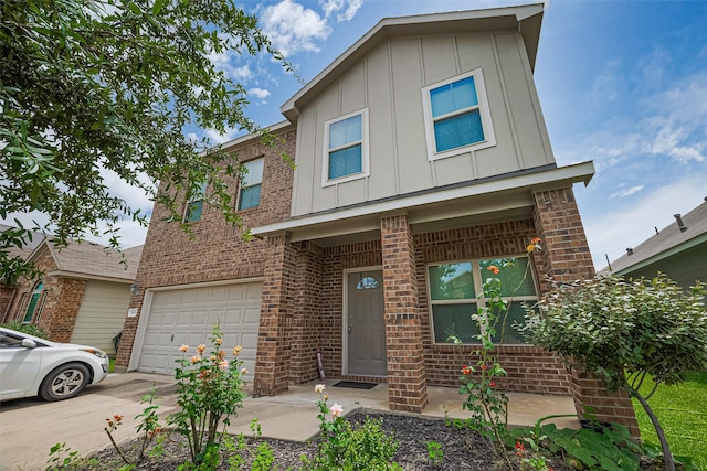 3638 Bright Moon Ct, Katy, TX 77449 - view of front of house featuring board and batten siding, brick siding, a garage, and concrete driveway