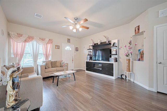 3638 Bright Moon Ct, Katy, TX 77449 - living area featuring ceiling fan and wood finished floors