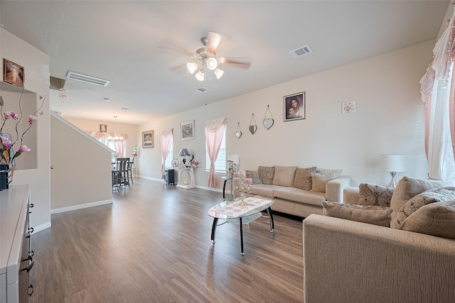 3638 Bright Moon Ct, Katy, TX 77449 - living room with wood finished floors, a chandelier, and ceiling fan