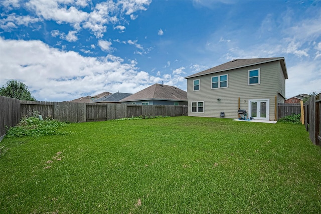 3638 Bright Moon Ct, Katy, TX 77449 - rear view of house with french doors, a fenced backyard, and a patio area