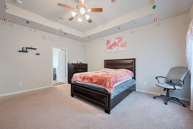 3638 Bright Moon Ct, Katy, TX 77449 - carpeted bedroom with a raised ceiling, a ceiling fan, and ensuite bathroom