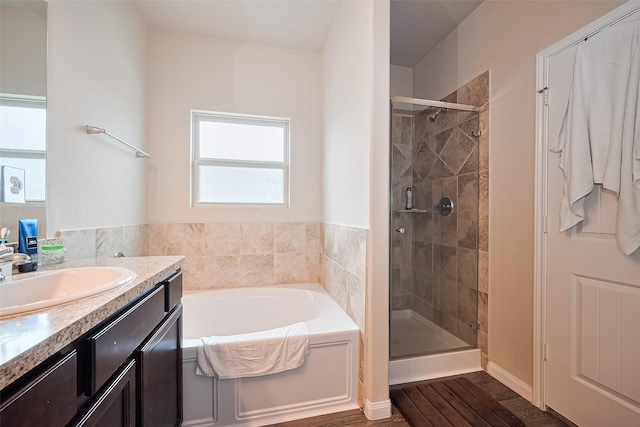 3638 Bright Moon Ct, Katy, TX 77449 - bathroom with a garden tub, vanity, a shower stall, and wood finished floors