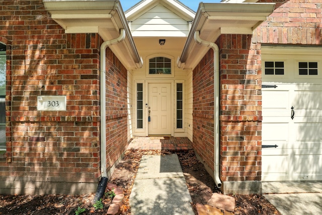 303 Burris Park Dr, Spring, TX 77373 - property entrance with brick siding and an attached garage