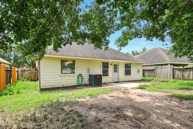 303 Burris Park Dr, Spring, TX 77373 - rear view of house featuring a fenced backyard, a patio, and a shingled roof