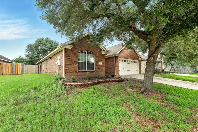 303 Burris Park Dr, Spring, TX 77373 - view of front facade with brick siding, concrete driveway, and a garage
