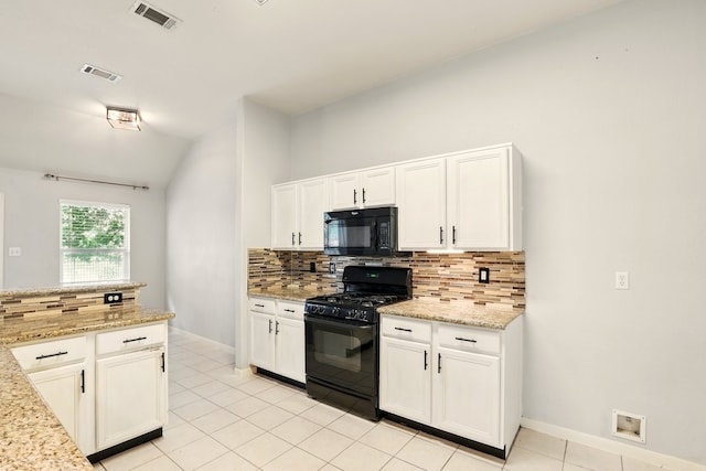 303 Burris Park Dr, Spring, TX 77373 - kitchen with black appliances, decorative backsplash, white cabinetry, lofted ceiling, and light tile patterned floors
