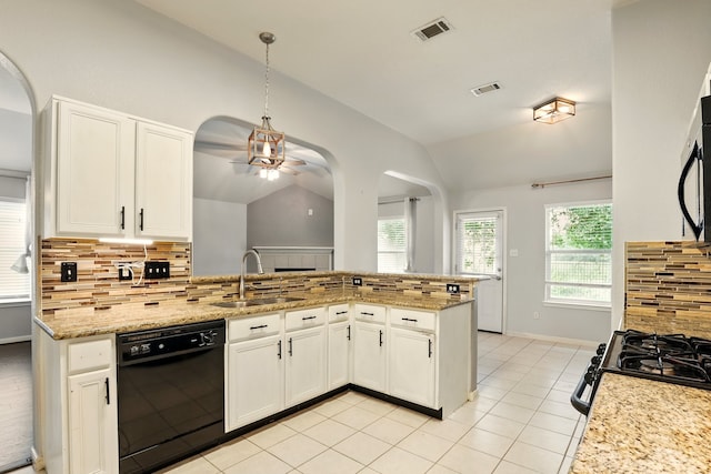 303 Burris Park Dr, Spring, TX 77373 - kitchen with black dishwasher, vaulted ceiling, ceiling fan, decorative backsplash, and white cabinets