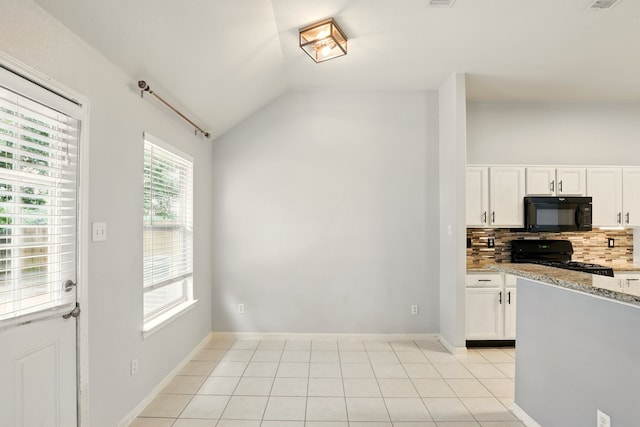 303 Burris Park Dr, Spring, TX 77373 - kitchen featuring black appliances, vaulted ceiling, backsplash, white cabinets, and light stone countertops