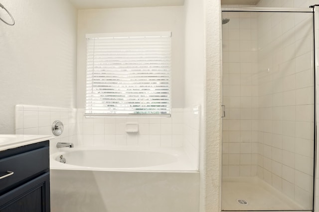 303 Burris Park Dr, Spring, TX 77373 - full bathroom featuring a stall shower, a bath, and vanity