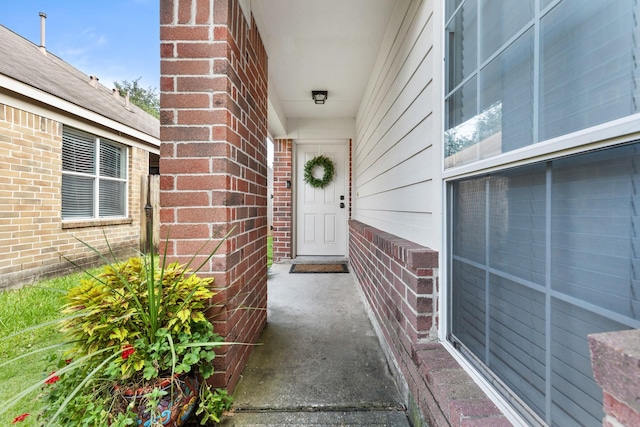2306 Urban Forest Ct, Spring, TX 77386 - view of exterior entry featuring brick siding