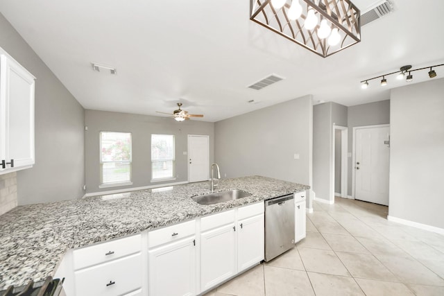 2214 Naomi St, Houston, TX 77054 - kitchen featuring dishwasher, light tile patterned flooring, light stone countertops, white cabinets, and a ceiling fan