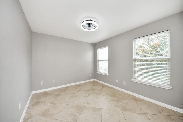 2214 Naomi St, Houston, TX 77054 - empty room with light tile patterned flooring and baseboards