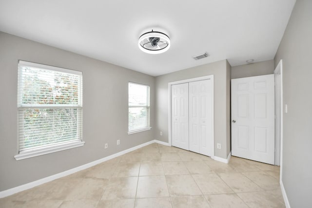 2214 Naomi St, Houston, TX 77054 - unfurnished bedroom with light tile patterned floors and a closet