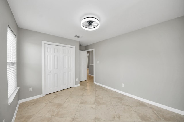2214 Naomi St, Houston, TX 77054 - unfurnished bedroom with light tile patterned floors and a closet