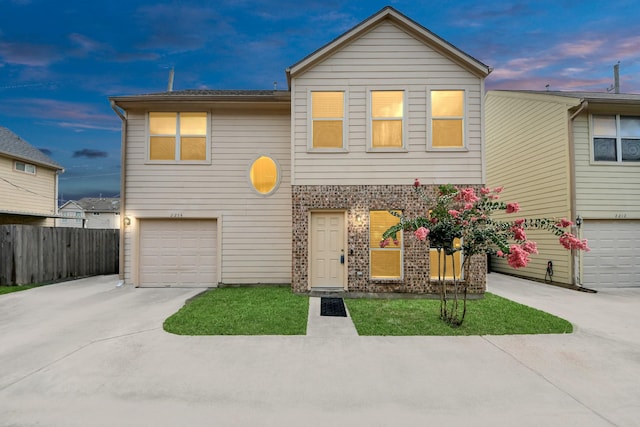 2214 Naomi St, Houston, TX 77054 - view of front facade with a garage, driveway, and brick siding