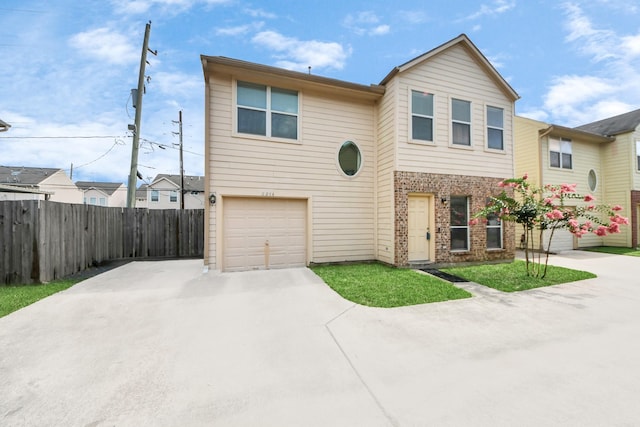2214 Naomi St, Houston, TX 77054 - view of property with concrete driveway, a garage, and brick siding