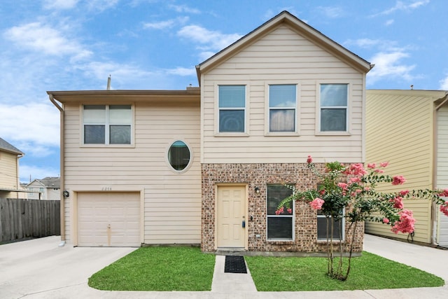 2214 Naomi St, Houston, TX 77054 - view of front of home with concrete driveway, a garage, and brick siding