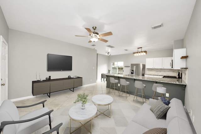 2214 Naomi St, Houston, TX 77054 - living room featuring a ceiling fan and light tile patterned floors