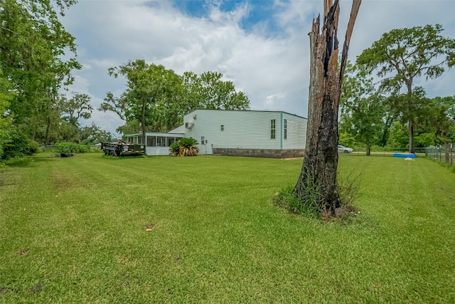 1725 County Road 244e, Brazoria, TX 77422 - view of grassy yard with a sunroom