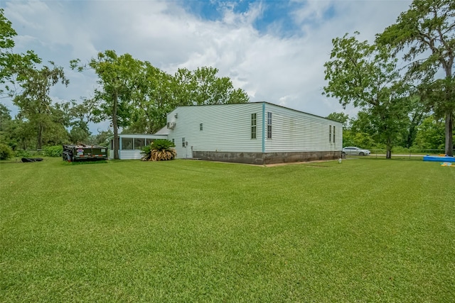 1725 County Road 244e, Brazoria, TX 77422 - view of grassy yard featuring a sunroom