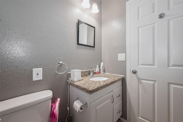 1725 County Road 244e, Brazoria, TX 77422 - bathroom featuring vanity and a textured wall