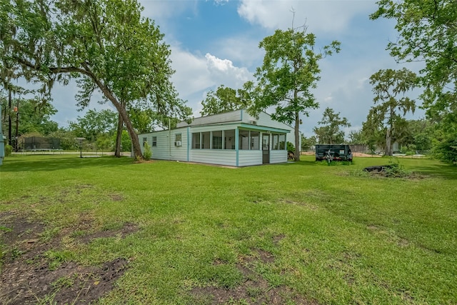 1725 County Road 244e, Brazoria, TX 77422 - view of green lawn featuring a sunroom
