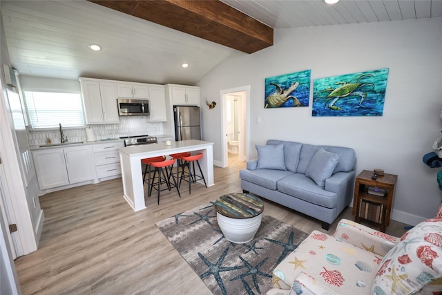 4022 3rd St, Galveston, TX 77554 - living room with light wood finished floors and recessed lighting