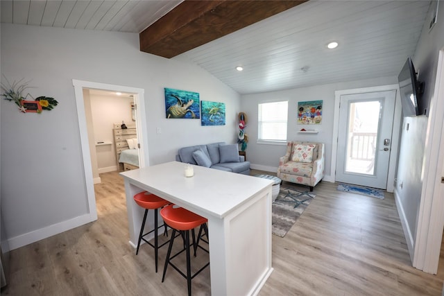 4022 3rd St, Galveston, TX 77554 - kitchen with a kitchen bar, light wood finished floors, light countertops, recessed lighting, and a kitchen island
