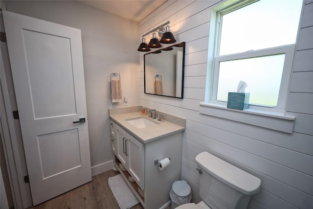 4022 3rd St, Galveston, TX 77554 - half bath featuring vanity, wood finished floors, and wooden walls