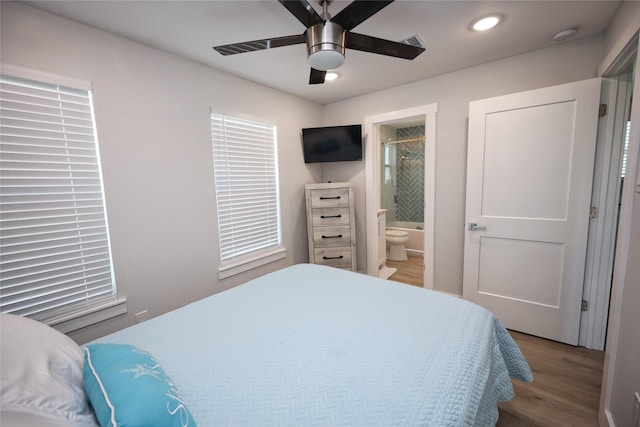 4022 3rd St, Galveston, TX 77554 - bedroom featuring wood finished floors, ensuite bathroom, recessed lighting, and ceiling fan