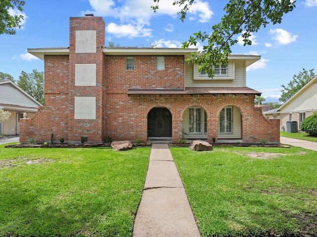 16434 Heatherdale Dr, Houston, TX 77059 - view of front facade featuring a chimney, a front lawn, brick siding, and covered porch