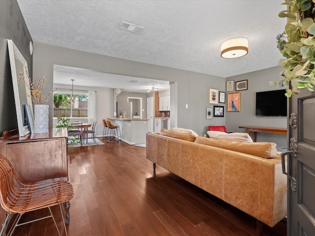 16434 Heatherdale Dr, Houston, TX 77059 - living area with dark wood-style floors and a textured ceiling