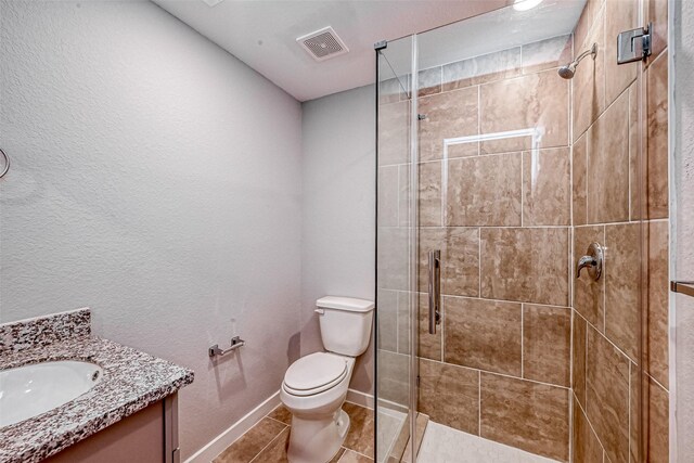 8125 Eastover St Unit Ab, Houston, TX 77028 - full bathroom featuring vanity, a stall shower, tile patterned floors, and a textured wall