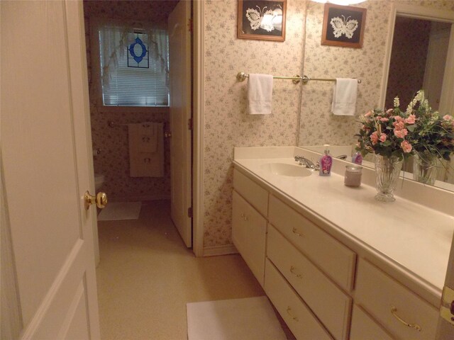 1501 E Pecan St, Brenham, TX 77833 - bathroom featuring wallpapered walls and vanity