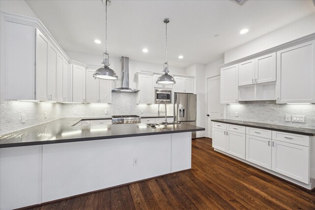 2509 Dorrington Blvd Unit B, Houston, TX 77030 - kitchen with wall chimney range hood, appliances with stainless steel finishes, dark countertops, backsplash, and recessed lighting