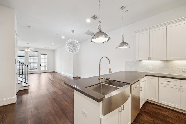 2509 Dorrington Blvd Unit B, Houston, TX 77030 - kitchen with a peninsula, dark countertops, tasteful backsplash, recessed lighting, and dark wood finished floors