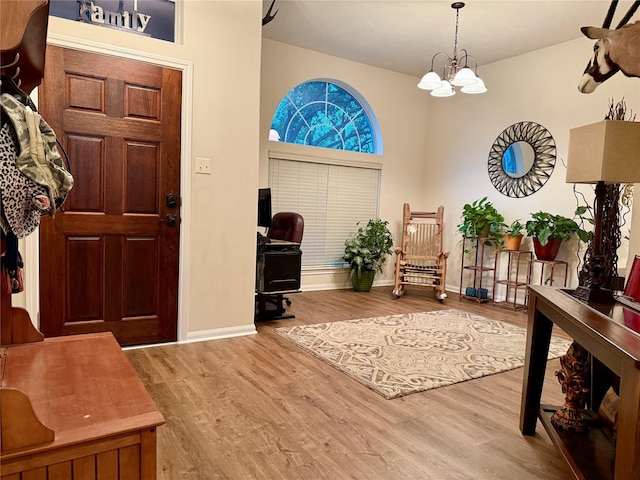 913 S Belle Dr, Angleton, TX 77515 - entrance foyer featuring wood finished floors and a chandelier