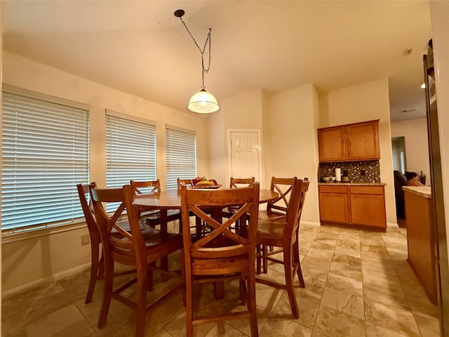 913 S Belle Dr, Angleton, TX 77515 - dining room featuring lofted ceiling and baseboards